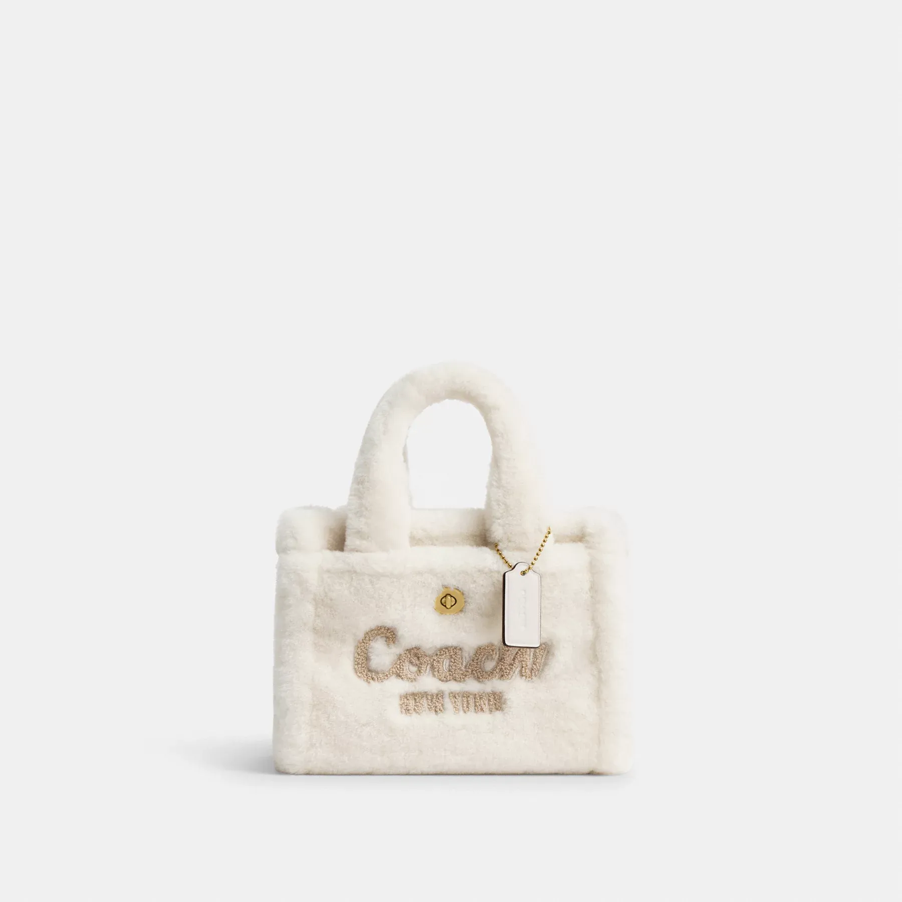 COACH Cargo-Tragetasche 20 aus Lammfell Kreide