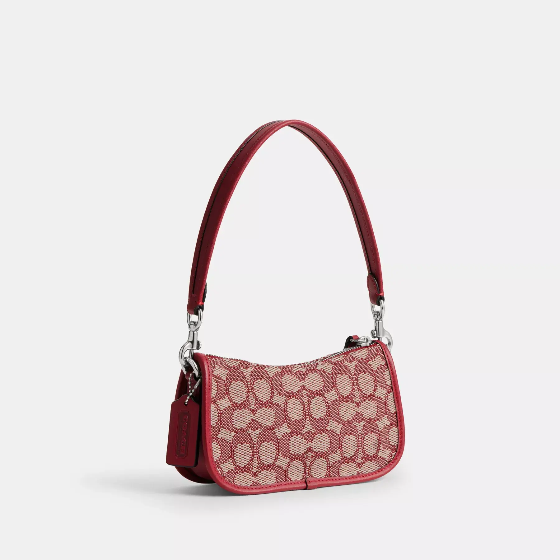 COACH Swinger 20 aus charakteristischem Jacquard Rubin Elfenbein