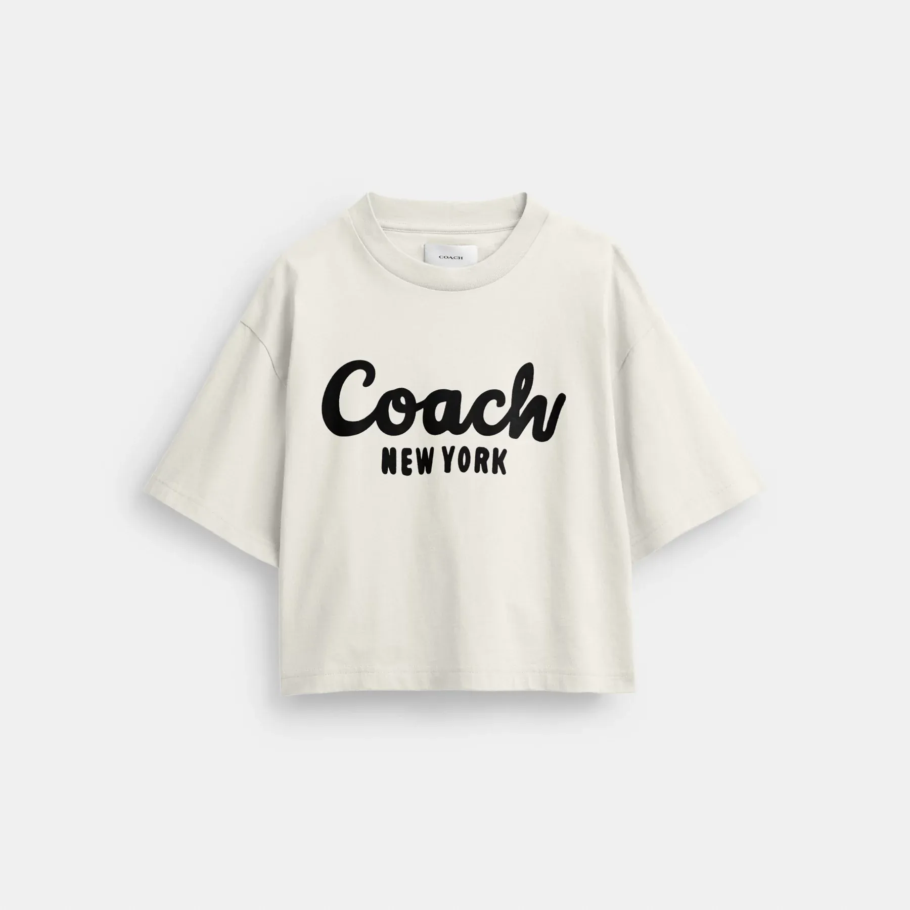 COACH Kurzes T-Shirt mit kursivem Signature-Print Creme