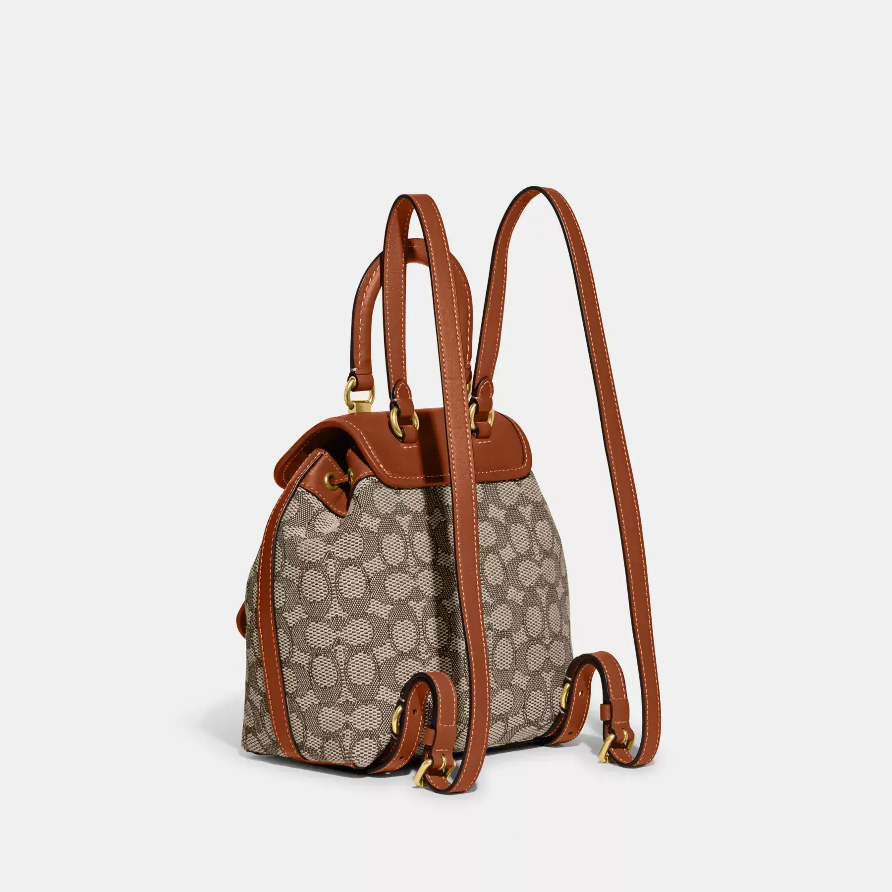 COACH Riya Rucksack 21 aus charakteristischem Textil-Jacquard Kakaopolierter Amb