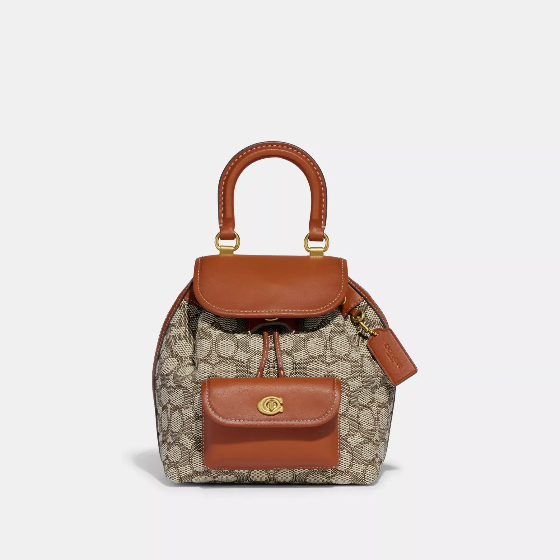 COACH Riya Rucksack 21 aus charakteristischem Textil-Jacquard Kakaopolierter Amb