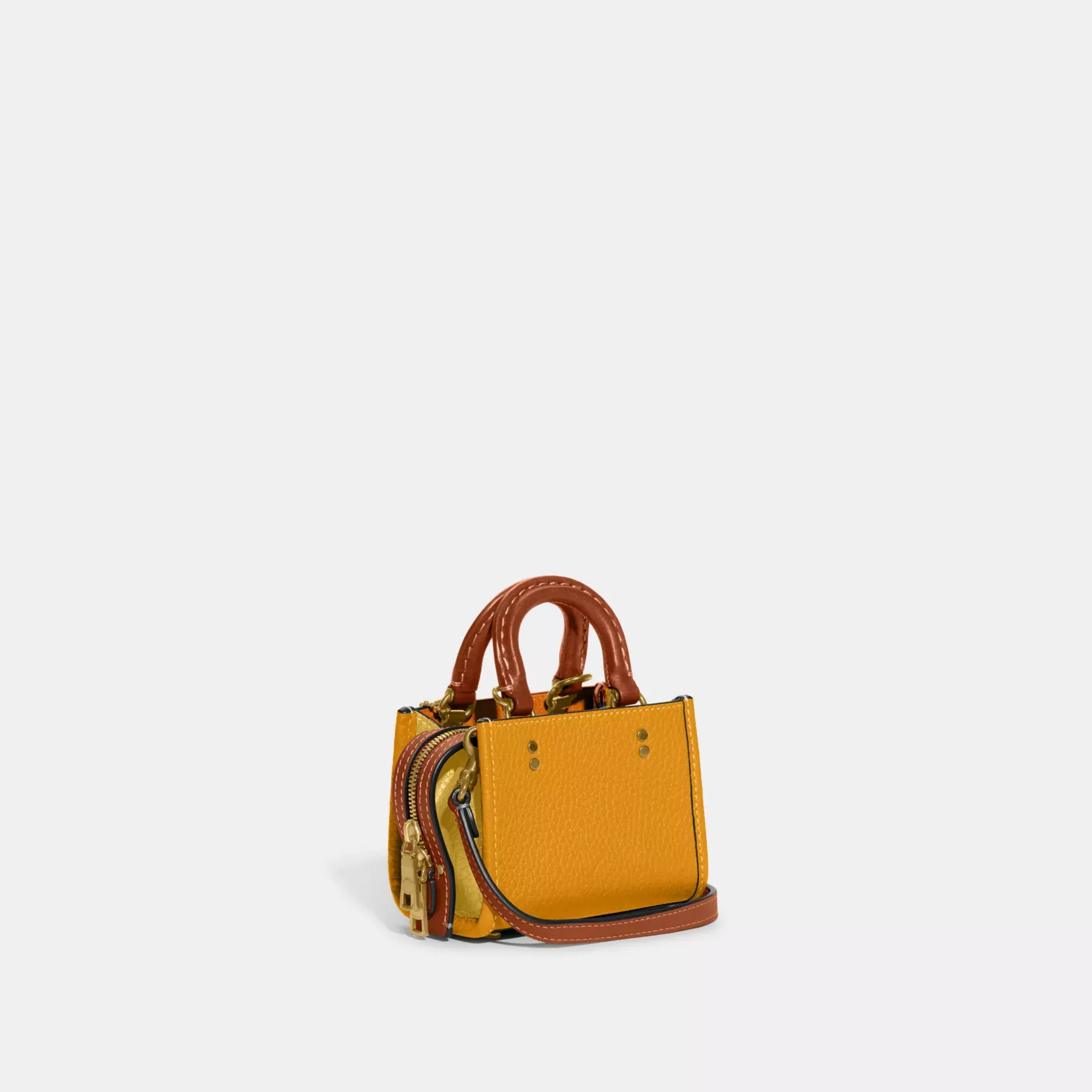 COACH Rogue 12 aus regenerativem Leder in Farbblock-Optik Butterblume Multi